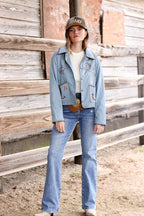Woman wearing a light blue suede embroidered  jacket with patches, jeans, and a  Texas Embroidered Trucker Hat - Gold/Olive-FleaStyle