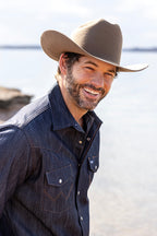 Man wearing a Rider Wool Cowboy Hat - Brown denim shirt outdoors