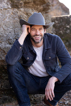 Man wearing a Flea Style Rider Charcoal Wool Western Hat and dark jacket and cowboy boots-Fleastyle.