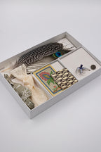 Collection of vintage items including feathers, cards, and a brooch- Bohemian Hat Styling Kit - Blue Hummingbird Brooch