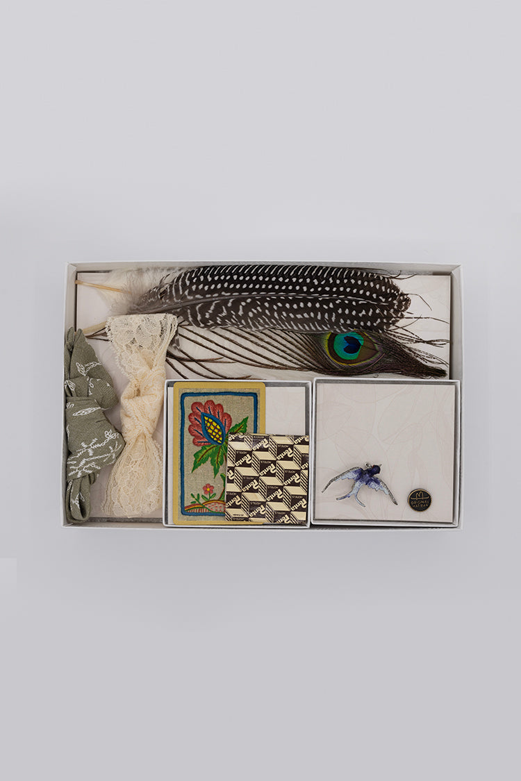 Collection of vintage items including feathers, cards, and a brooch- Bohemian Hat Styling Kit - Blue Hummingbird Brooch
