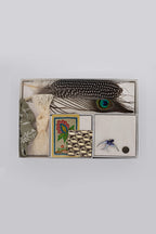 Collection of vintage items including feathers, cards, and a brooch- Bohemian Hat Styling Kit - Blue Hummingbird Brooch