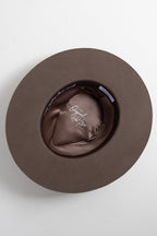 Brown flat brim hat with decorative feathers and turquoise stone brooches and custom hat bands-Flea Style
