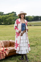 Woman sitting outdoors in a field wearing Lenny Wool Short-Brim Hat - Blush-Fleastyle